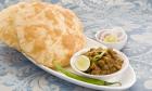 Pay Rs.7 & Get a Plate of Chole Bathure at Om Sweets